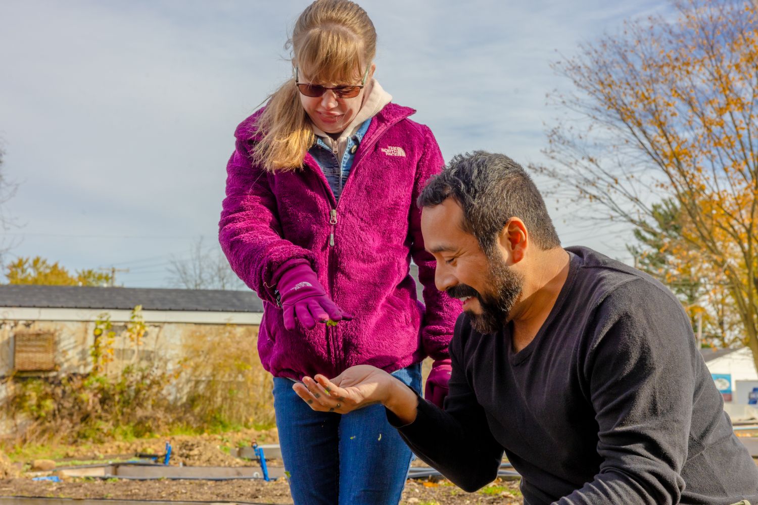 Two people tending a garden