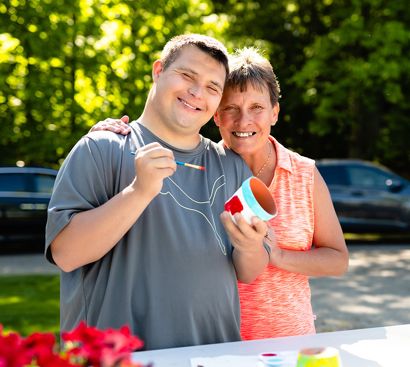 Man and woman posing for a picture on the farm