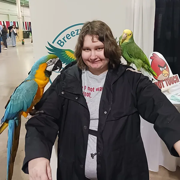 Pe Expo Holding Parrots